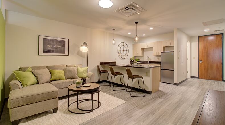 Here is an apartment living area in the Third + Dayton building. PROVIDED