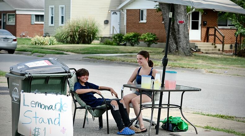 A way to beat the heat and make money Emma Guernsey, age 11 and Jazlynn Hambidge, age 13, set up a lemonade stand on Kaufman Avenue in Fairborn, Tuesday, June 18, 2024. MARSHALL GORBY \STAFF