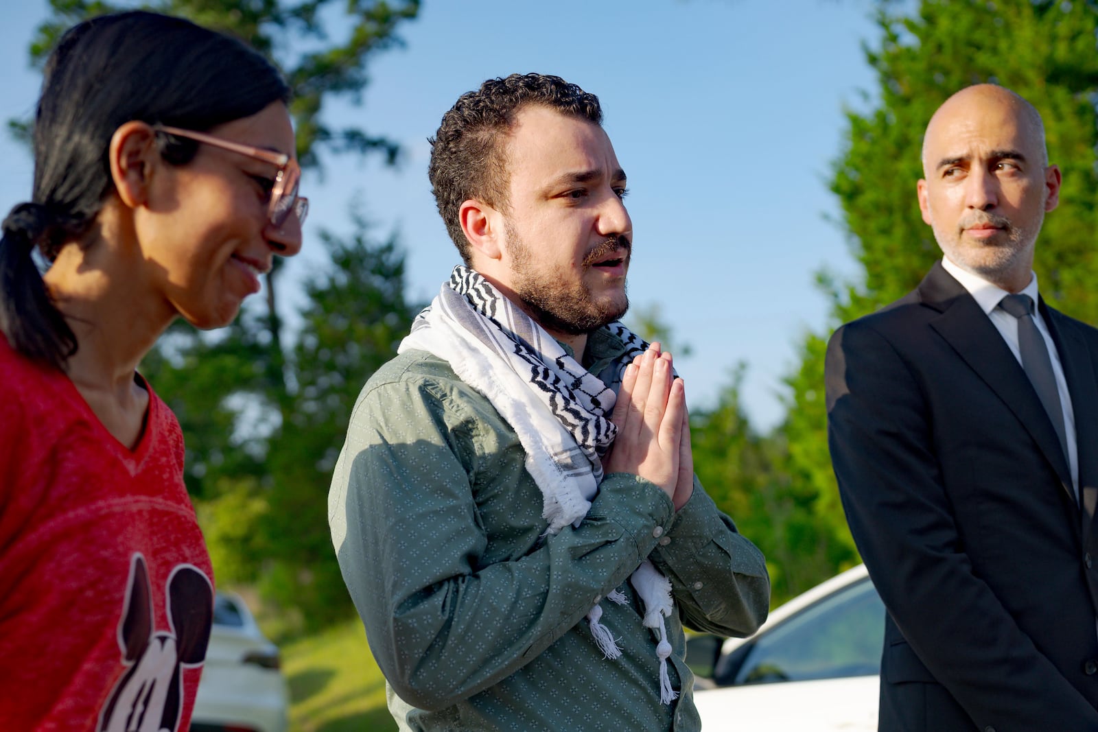 Palestinian activist Mahmoud Khalil, center, speaks after his release from federal immigration detention in Jena, La., Friday, June 20, 2025. (AP Photo/Matthew Hinton)
