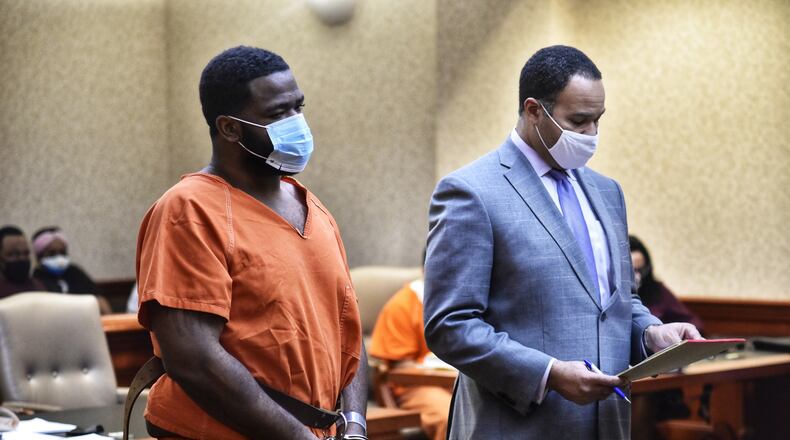 Mychel King and his attorney Lawrence Hawkins III were in Butler County Common Pleas Court on Thursday. King is charged with murder, aggravated murder, four counts of aggravated robbery, two counts of felonious assault and one count of probation violation. NICK GRAHAM / STAFF