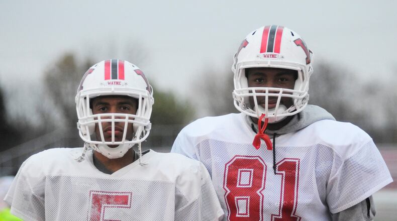 Seniors D'Mitrik Trice (left) and Ahmad Wagner are key Wayne High School football and basketball players. MARC PENDLETON / STAFF