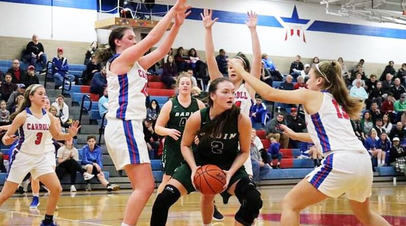 Badin’s Shelby Nusbaum (2) finds herself surrounded by Carroll Patriots, including Julia Keller (42) and Jillian Roberts (13), during Saturday afternoon’s game in Riverside. Carroll won 64-57. CONTRIBUTED PHOTO BY TERRI ADAMS