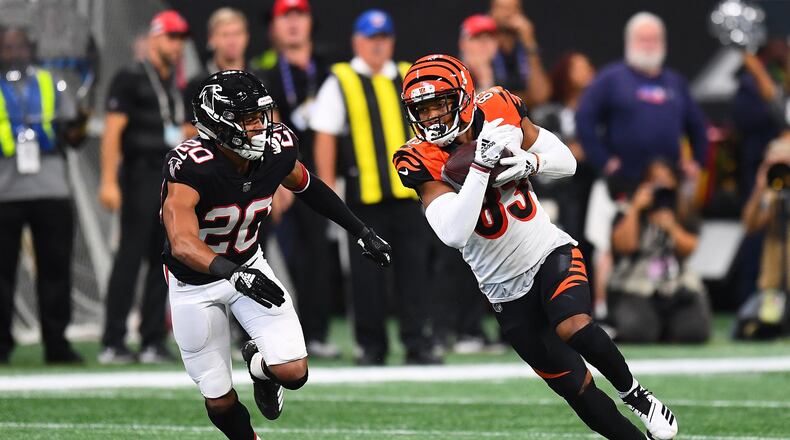 ATLANTA, GA - SEPTEMBER 30: Tyler Boyd #83 of the Cincinnati Bengals runs past Isaiah Oliver #20 of the Atlanta Falcons during the third quarter at Mercedes-Benz Stadium on September 30, 2018 in Atlanta, Georgia. (Photo by Scott Cunningham/Getty Images)