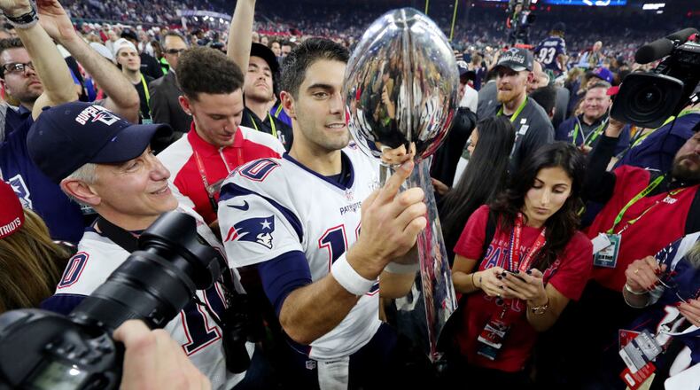 HOUSTON, TX - FEBRUARY 05: Jimmy Garoppolo #10 of the New England Patriots holds the Vince Lombardi Trophy after defeating the Atlanta Falcons 34-28 in overtime during Super Bowl 51 at NRG Stadium on February 5, 2017 in Houston, Texas. (Photo by Tom Pennington/Getty Images)