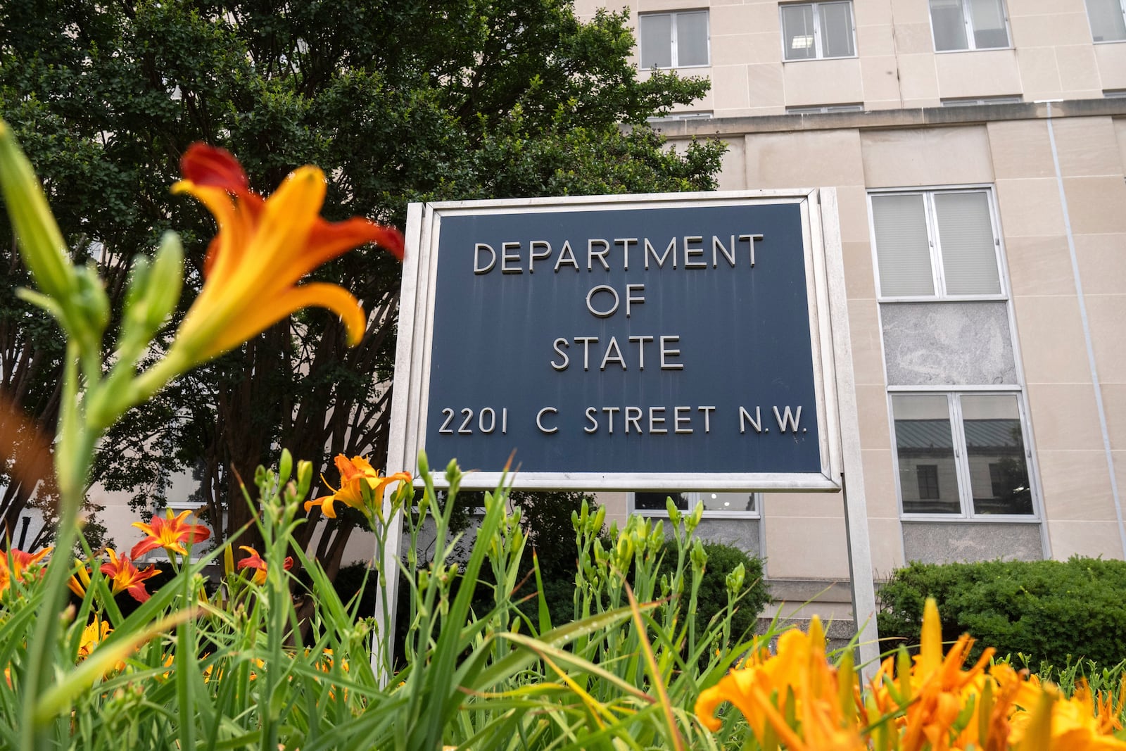 A sign is seen outside the headquarters of the Department of State, June 27, 2025, in Washington. (AP Photo/Mark Schiefelbein)