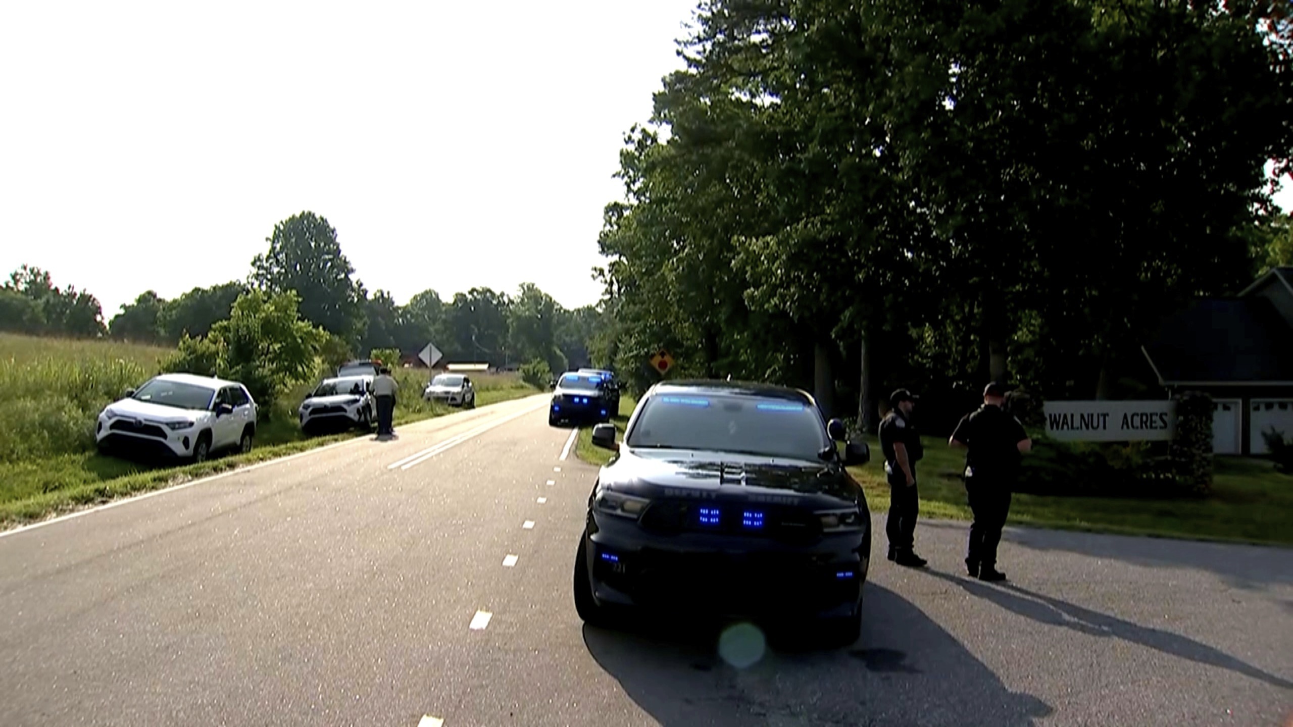 In this image taken from WSOC video, various police vehicles gather outside a community after a mass shooting, Sunday, June 1, 2025, in Hickory, a city in Catawba County, N.C. (WSOC via AP)