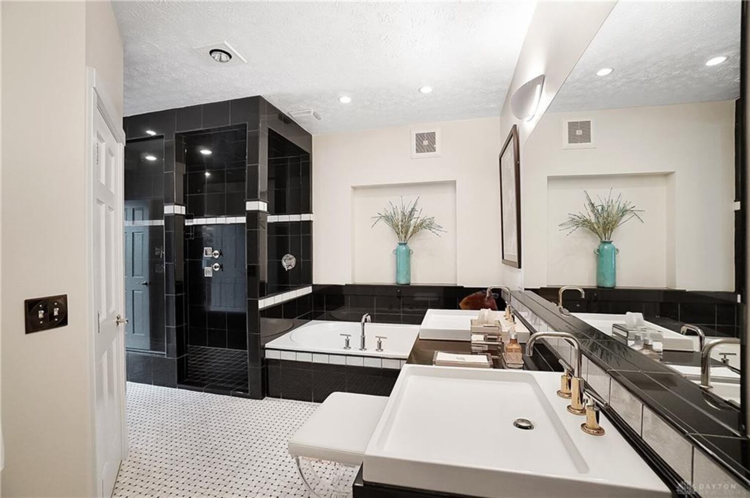 PHOTOS: Spectacular $1.8M luxury home on market with pool, golf simulator