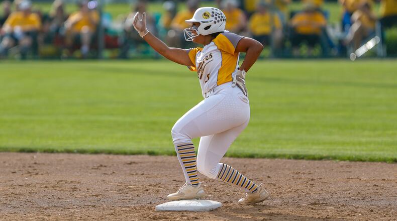 Kenton Ridge's Cara Cammon celebrates at second base during the Cougars 6-2 victory over Granville in the D-II regional championship game at Wright State University last May. Michael Cooper/CONTRIBUTED