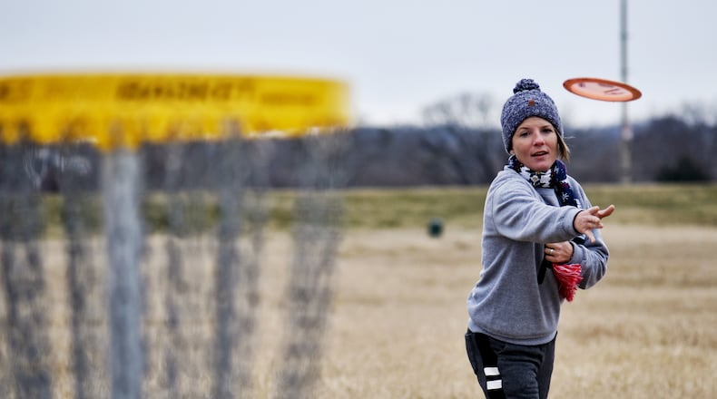 Amber Johnson plays disc golf at Miami University Hamilton Campus Thursday, February 4, 2021 in Hamilton. NICK GRAHAM  / STAFF