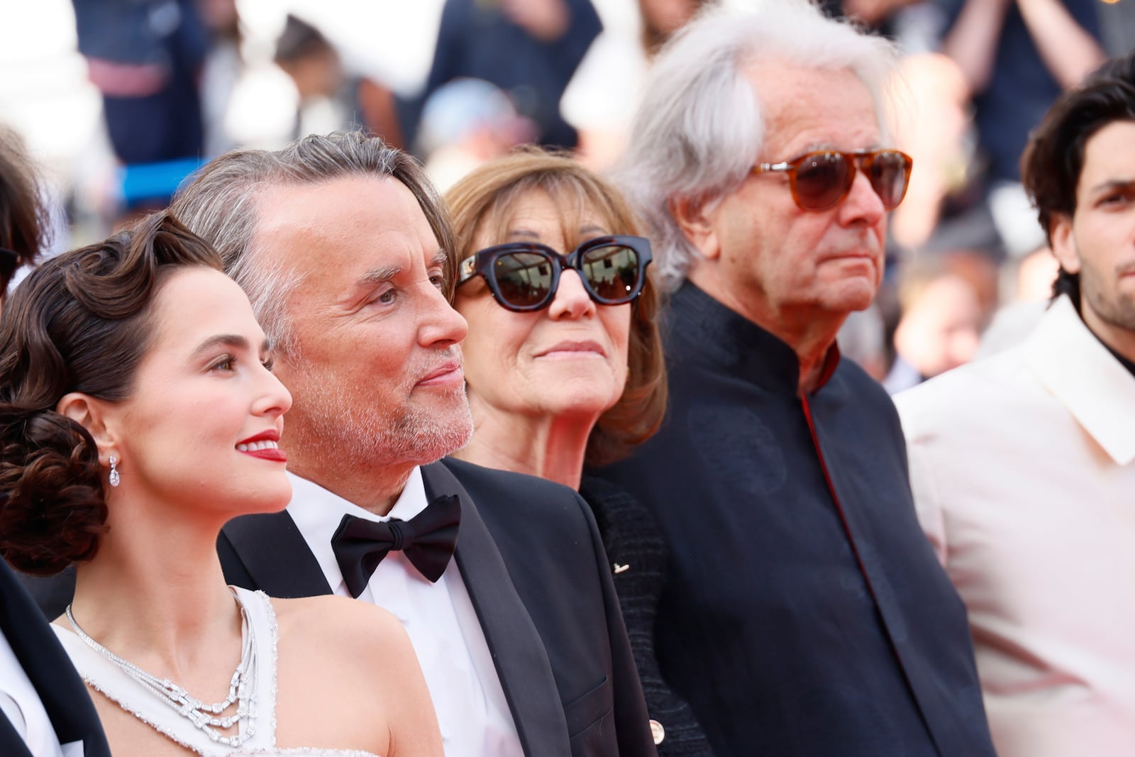 Zoey Deutch, from left, director Richard Linklater, Michele Halberstadt and producer Laurent Petin pose for photographers upon arrival at the premiere of the film 'Nouvelle Vague' at the 78th international film festival, Cannes, southern France, Saturday, May 17, 2025. (Photo by Joel C Ryan/Invision/AP)
