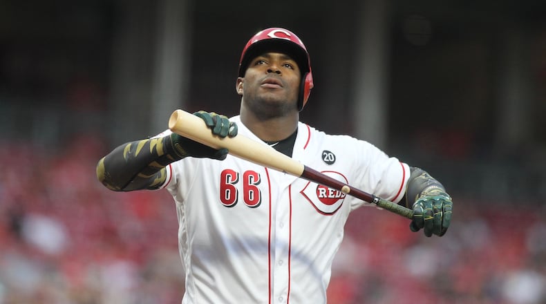 The Reds’ Yasiel Puig reacts after striking out against the Dodgers on Friday, May 17, 2019, at Great American Ball Park in Cincinnati. David Jablonski/Staff