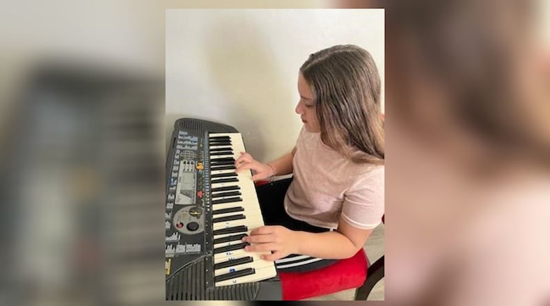 For Arelis Betancourt Franquiz, who is hearing impaired, teaching herself how to play the piano was in part born of boredom and an escape from the dreariness of isolation from the pandemic. “I was not really into the piano at first, but then I was bored, and I wanted to try something new rather than spend time on my phone all day,” said the 8th grader from Middletown Middle School shown her at home. (Provided Photo\Journal-News)