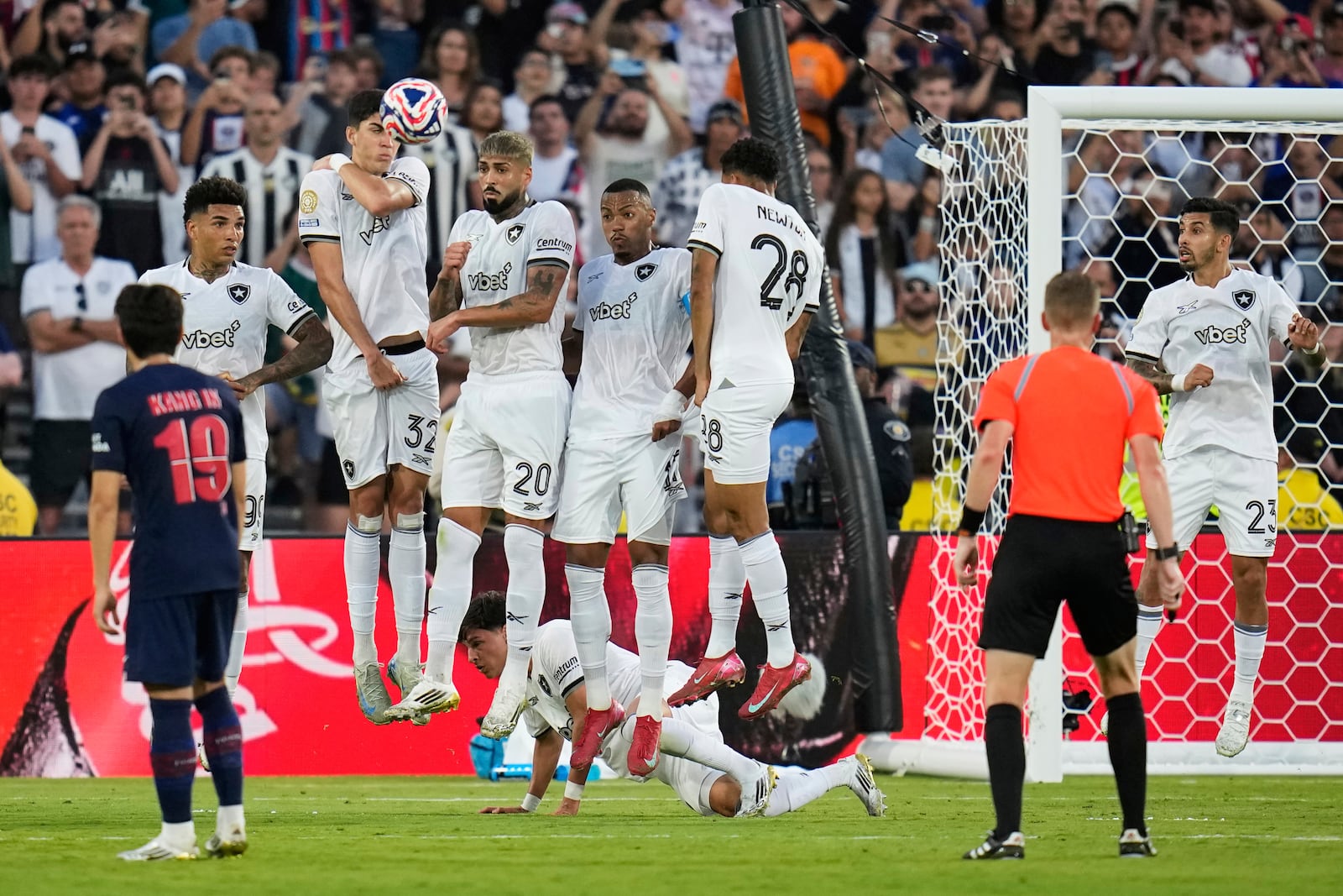 Botafogo defenders react as a free kick goes over them during the Club World Cup group B soccer match between PSG and Botafogo in Pasadena, Calif., Thursday, June 19, 2025. (AP Photo/Gregory Bull)