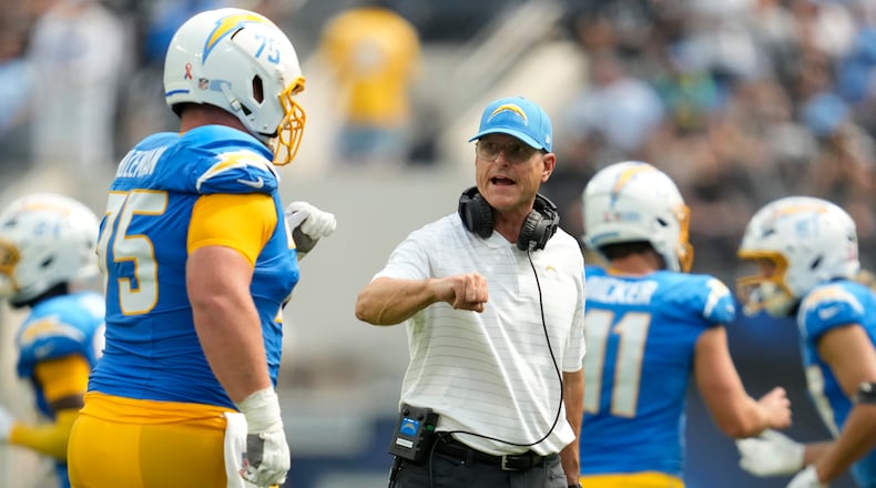 Los Angeles Chargers center Bradley Bozeman, left, is congratulated by head coach Jim Harbaugh after a field goal against the Las Vegas Raiders during the first half of an NFL football game, Sunday, Sept. 8, 2024, in Inglewood, Calif. (AP Photo/Ashley Landis)