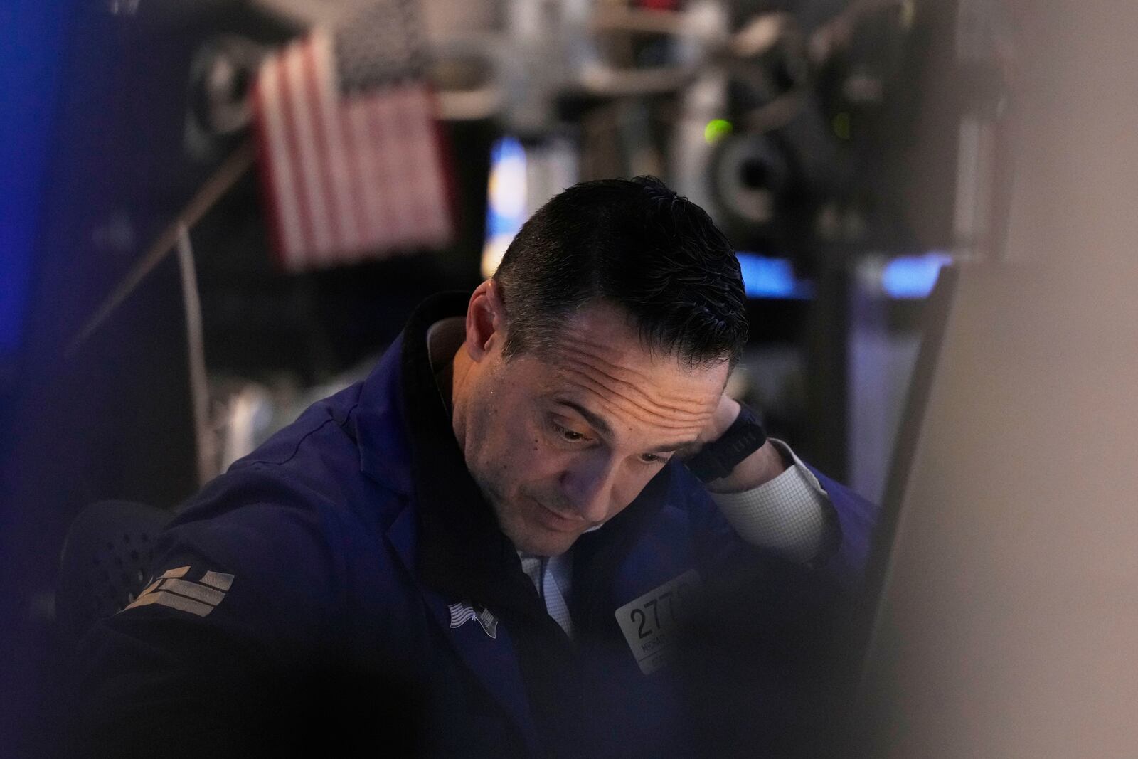 Specialist Michael Gagliano works at his post on the floor of the New York Stock Exchange, Thursday, April 10, 2025. (AP Photo/Richard Drew)