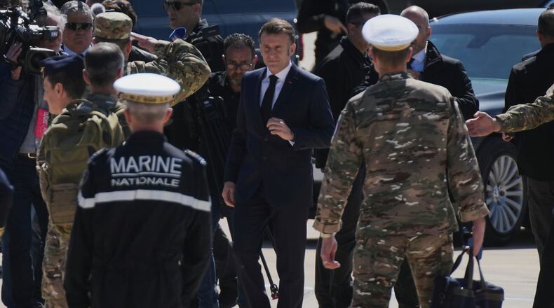 French President Emmanuel Macron arrives at Andreas Papandreou Air Base ahead of his meeting with Cyprus President Nikos Christodoulides and Greece's Prime Minister Kyriakos Mitsotakis in Paphos, Cyprus, on Monday, March 9, 2026. (AP Photo/Petros Karadjias)
