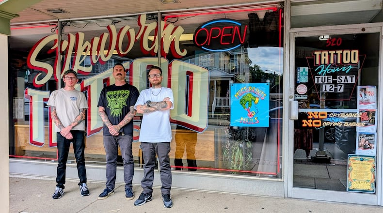 Devin Spenny, Kevin Betsch and Richard Bowers, co-owners and tattoo artists at Silkworm Tattoo, celebrate 15 years in business in Hamilton. Provided.