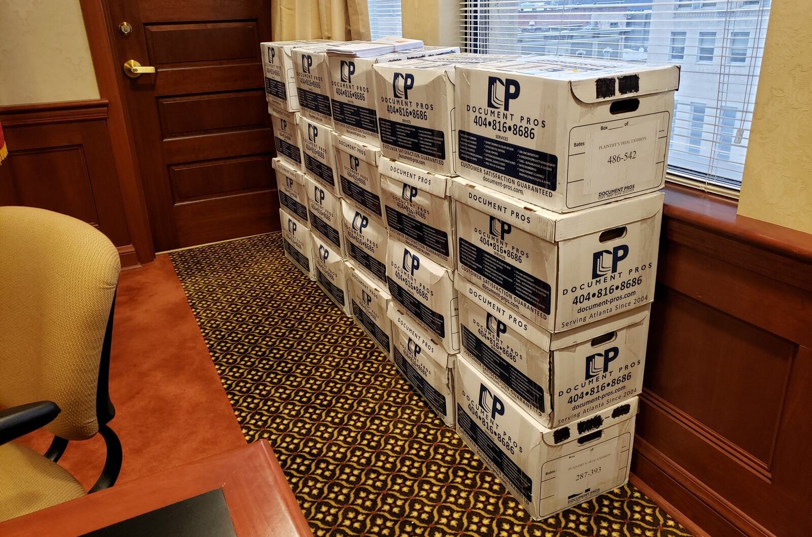 Boxes of evidence stacked in Butler county Common Pleas Judge Greg Howard’s courtroom that will be a part of a wrongful death civil trial involving a crash the killed a Hamilton woman in 2017. NICK GRAHAM/STAFF