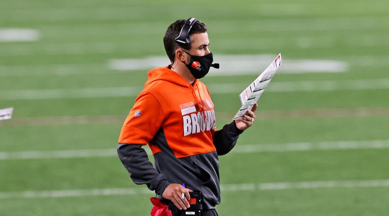 Cleveland Browns coach Kevin Stefanski looks at chart during the first half of the team's NFL football game against the Cincinnati Bengals, Thursday, Sept. 17, 2020, in Cleveland. (AP Photo/Ron Schwane)