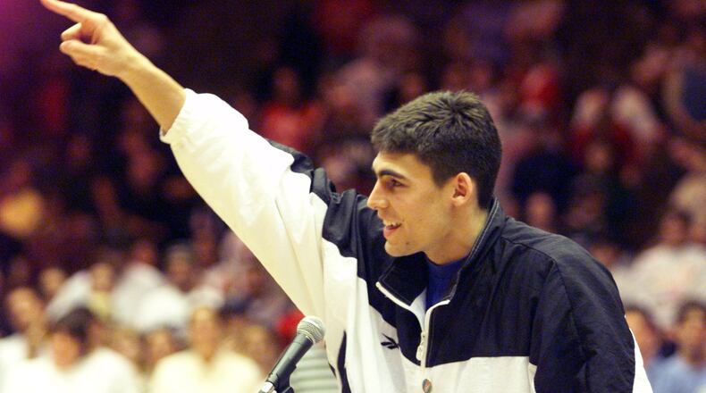Wally Szczerbiak acknowledges the crowd at a pep rally for the Miami Redhawks before they boarded the bus for the NCAA ‘Sweet 16’ game against Kentucky in St. Louis on Friday. The rally was held in Millet Hall. STAFF FILE PHOTO