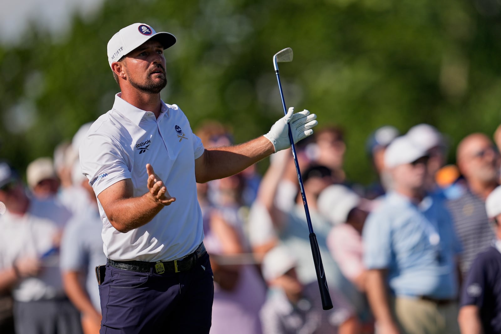 Bryson DeChambeau reacts after hitting his tee shot into the water on the 17th hole during the third round of the PGA Championship golf tournament at the Quail Hollow Club, Saturday, May 17, 2025, in Charlotte, N.C. (AP Photo/George Walker IV)