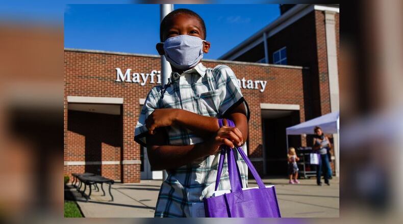 Middletown Schools said Tuesday they are returning to a mandatory mask policy for all students, teachers and school visitors in the wake of surging COVID-19 positive case numbers. The 6,300-student district, which resumes classes Thursday after winter break, will require everyone inside the district's 10 school buildings to wear a protective mask. (File Photo/Journal-News)
