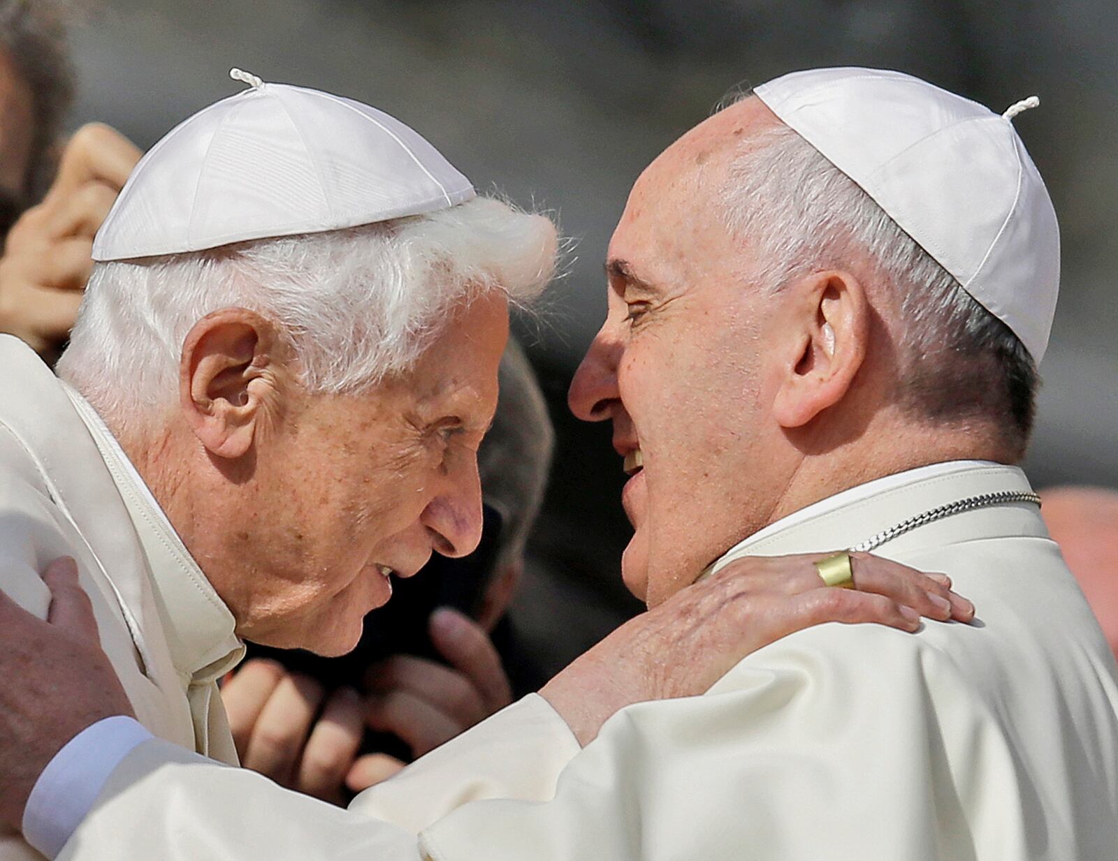 FILE - Pope Francis, right, hugs Emeritus Pope Benedict XVI prior to the start of a meeting with older faithful in St. Peter's Square at the Vatican, Sept. 28, 2014. (AP Photo/Gregorio Borgia, File)