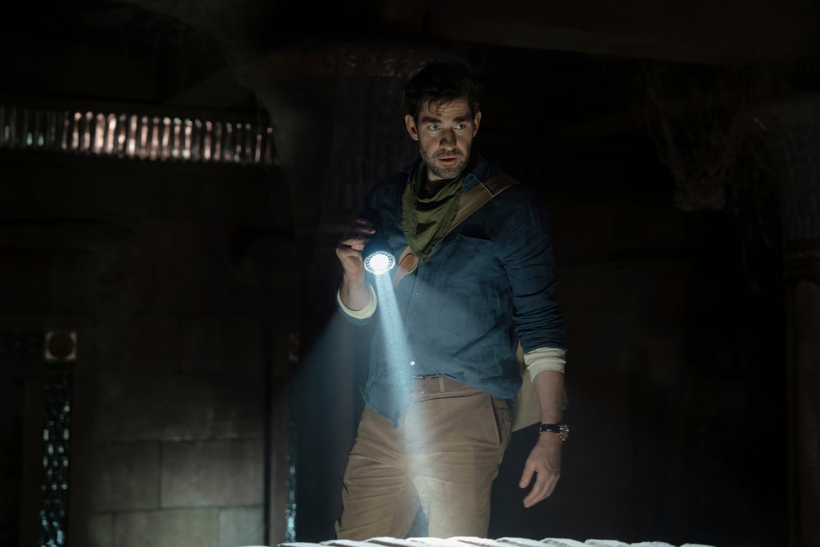 This image released by Apple TV+ shows John Krasinski in a scene from the film "Fountain of Youth." (Christopher Raphael/Apple TV+ via AP)