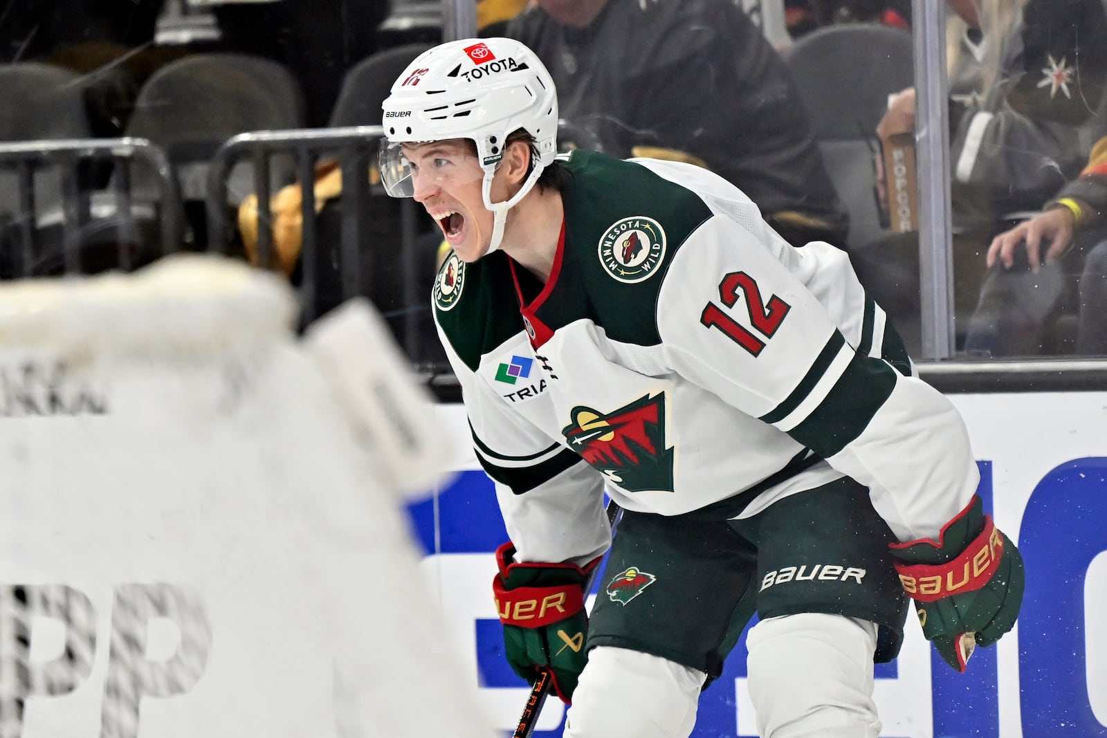 Minnesota Wild left wing Matt Boldy (12) reacts after scoring against the Vegas Golden Knights during the third period of Game 5 of a first-round NHL hockey playoff series Tuesday, April 29, 2025, in Las Vegas. (AP Photo/David Becker)