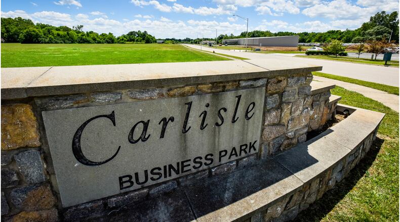 Carlisle City Council recently sold nearly 4.3 acres of land at the Carlisle Business Park for a new station and headquarters for the Joint Emergency Medical Services District off Ohio 123. The new facility is needed because some of the land where the current headquarters sits on East Sixth Street in Franklin will be needed to construct a roundabout as part of the construction of the new Franklin High School. In addition, the new station will be large enough to house the Carlisle Fire Department as well, according to city officials. The station will be located on the land adjacent to the sign in the photo. FILE PHOTO
A company with a state application pending for a marijuana cultivation license is asking Carlisle to further rollback its temporary ban to permit marijuana processing. NICK GRAHAM/STAFF