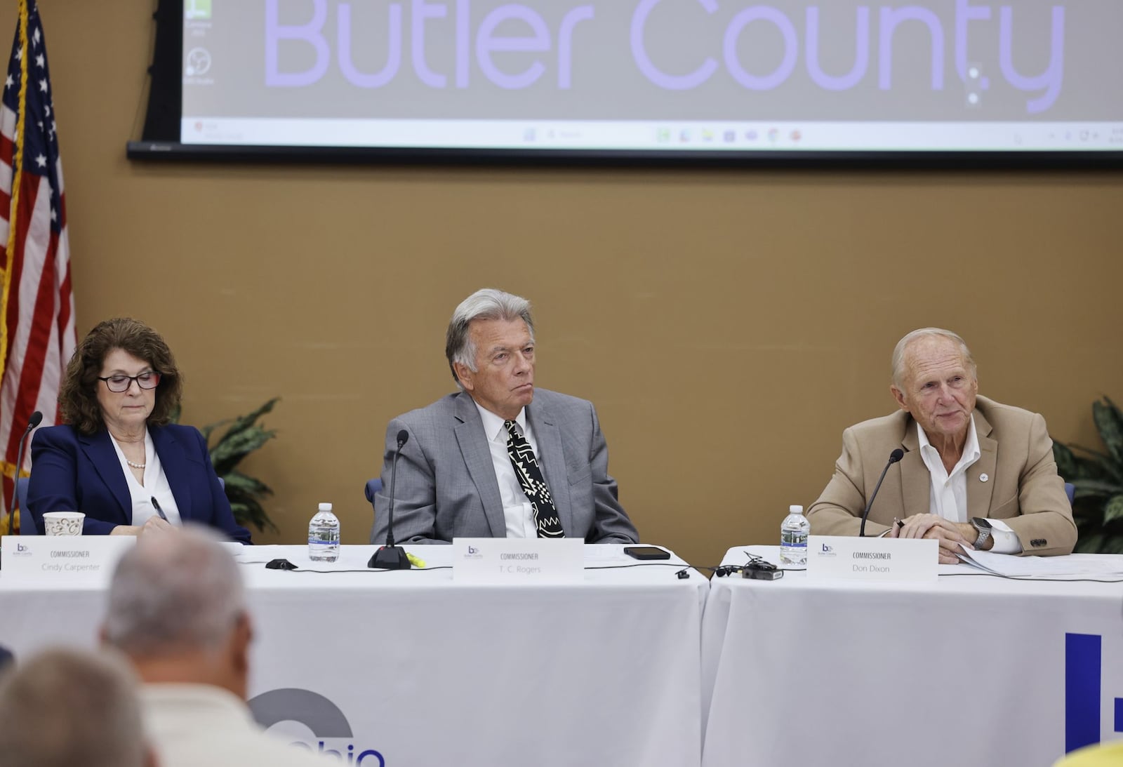 The Butler County Commission held a special meeting on Tuesday morning where many of the more than 100 supporters of the Butler County EMA voiced their concerns about the county taking over the agency. The commission have explored the necessary steps to needed to be taken in order to take control of the Butler County EMA, and a decision must be made by Sept. 30, 2025, if the county takes over the agency by Jan. 1, 2026. Pictured are, from right, Butler County commissioners Cindy Carpenter, TC Rogers and Don Dixon as they listen to public comments. NICK GRAHAM/STAFF