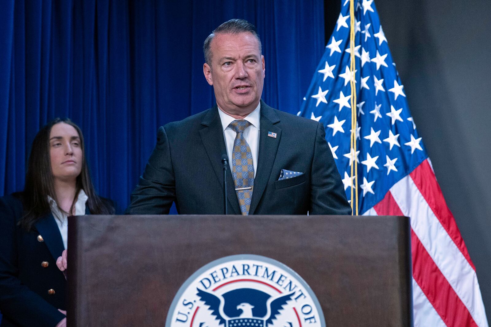 Acting director of U.S. Immigration and Customs Enforcement (ICE) Todd Lyons flanked by Deputy director of U.S. Immigration and Customs Enforcement Madison Sheahan, speaks during a news conference at ICE Headquarters, in Washington, Wednesday, May 21, 2025. (AP Photo/Jose Luis Magana)