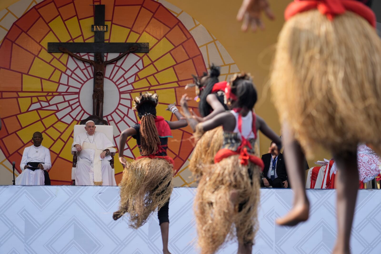FILE - Pope Francis watches people perform traditional dances at Martyrs' Stadium in Kinshasa, Democratic Republic of Congo, Feb. 2, 2023. (AP Photo/Gregorio Borgia, File)