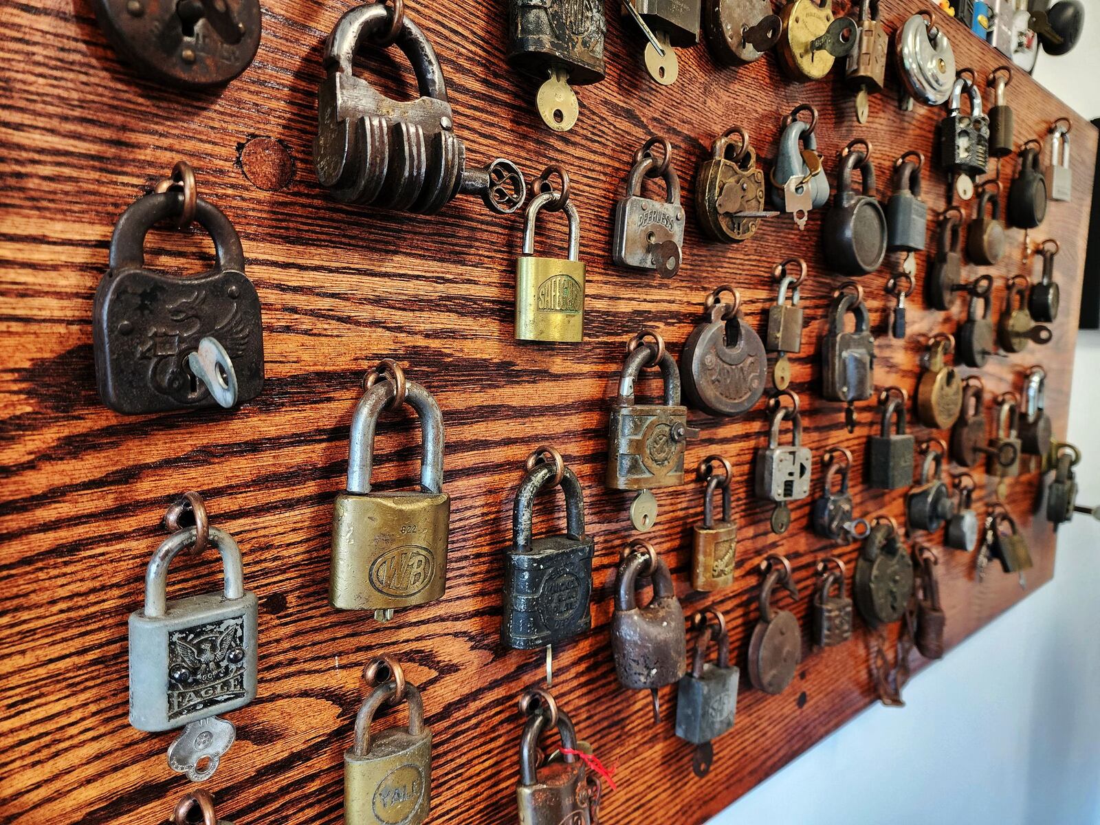 David Seidl, Miami University's vice president for information technology and chief information officer, has a unique hobby of picking locks and has a display board of  vintage locks behind his desk that his grandfather collected as a locksmith. NICK GRAHAM/STAFF