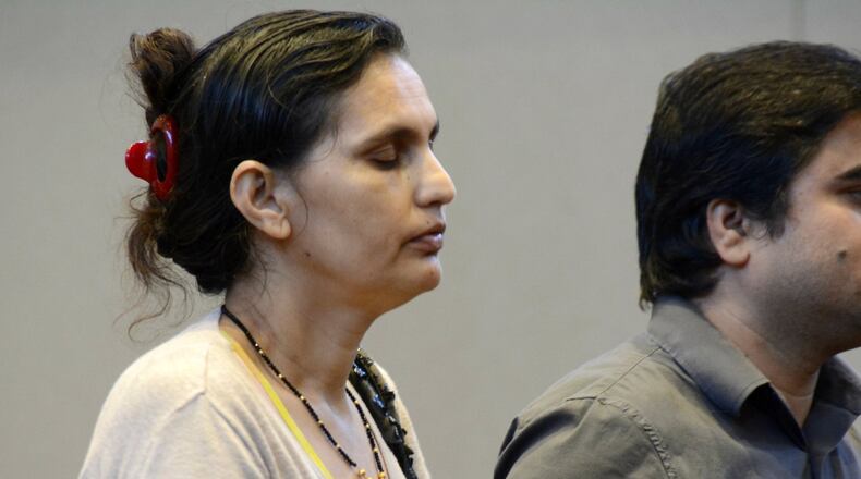 Subha Katel, 43, stands next to a court translator in Fairfield Municipal Court during a pre-trial hearing on Wednesday afternoon, Sept. 4, 2019. She is charged with negligent homicide in the shooting death of her husband, Tika Katel, 57. MICHAEL D. PITMAN/STAFF