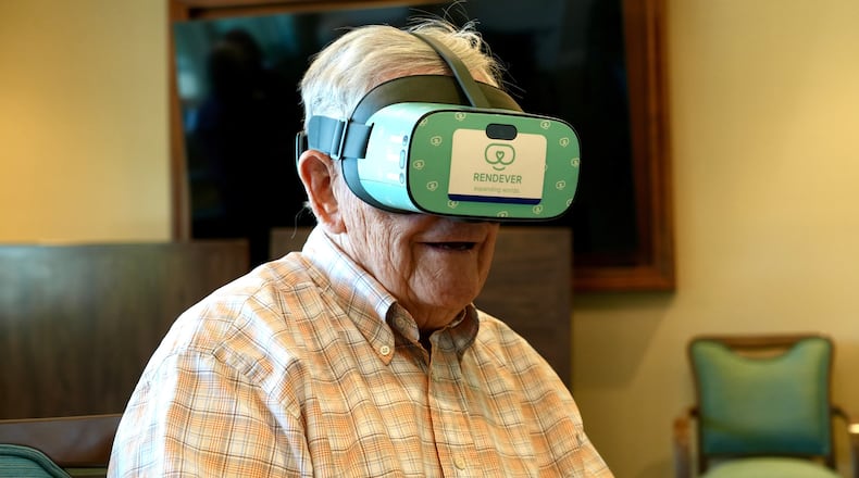 Jim Holtshouse watches video through a Rendever virtual-reality headset at the Forum at Rancho San Antonio retirement community in Cupertino, Calif. on June 11, 2025. (AP Photo/Terry Chea)