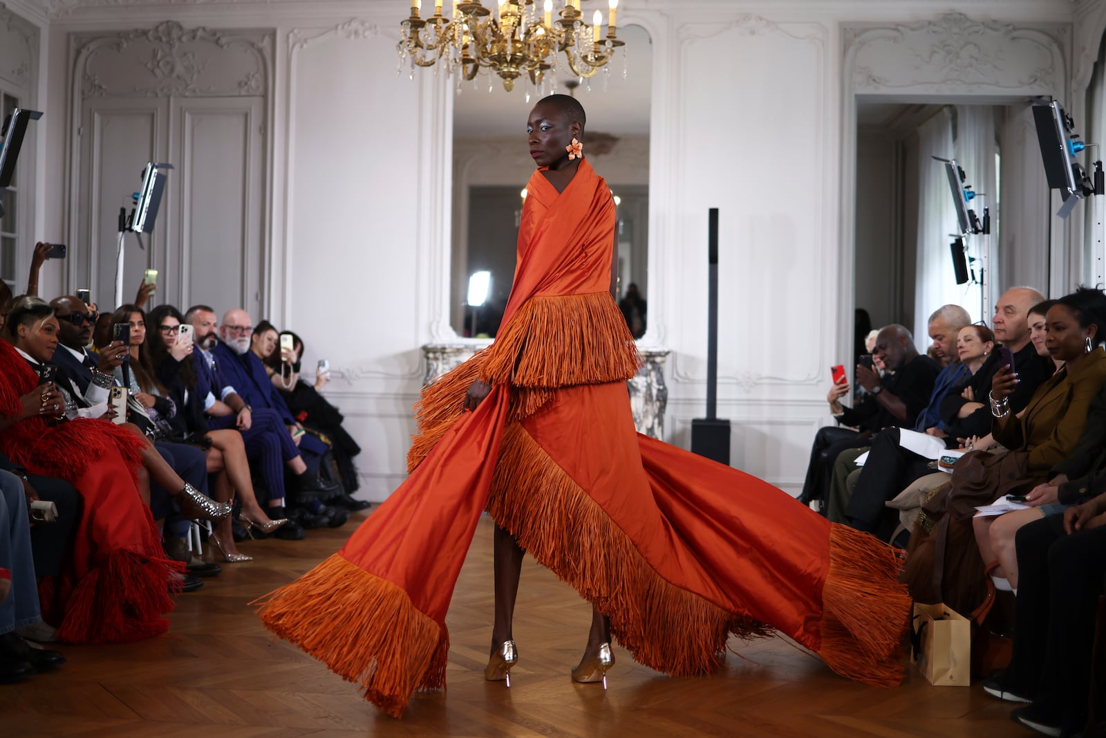 A model wears a creation as part of the Imane Ayissi Fall-Winter 2025/26 Haute Couture collection presented Monday, July 7, 2025, in Paris. (AP Photo/Tom Nicholson)
