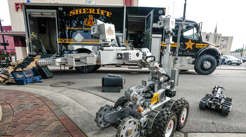 The Butler County Sheriff’s Office Bomb Squad was called to a Hamilton home today after a cleaning crew found a Japanese grenade and mortar round. NICK GRAHAM/STAFF