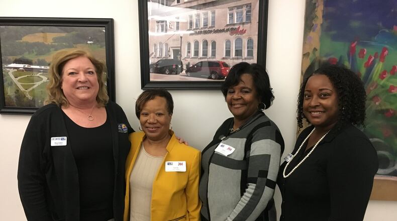 From left: Mag Baker, president and CEO of the Butler County United Way, Sandy Williams, director of HelpLink 2-1-1 Carla Tanner, database coordinator for HelpLink 2-1-1 and Krystal Tipton, vice-president of Community Impact for the Butler County United Way participated in an event designed to roll out details of the 2-1-1 service which is expanding in Butler, Warren and Clinton counties.