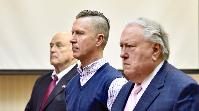 Butler County business man Jeff Couch, center, with attorney R. Scott Croswell III, right, was arraigned today in Butler County Common Pleas Court for felonious assault and domestic violence for an alleged assault at their West Chester Twp. home. NICK GRAHAM/STAFF