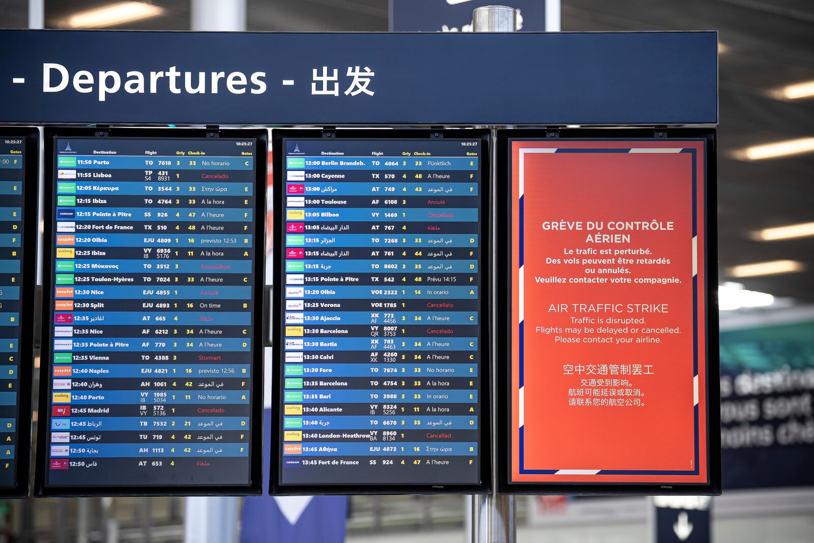 A departures information board is seen at Orly airport, near Paris, as French air traffic controllers launched a two-day strike to demand better working conditions, Friday, July 4, 2025. (AP Photo/Aurelien Morissard)