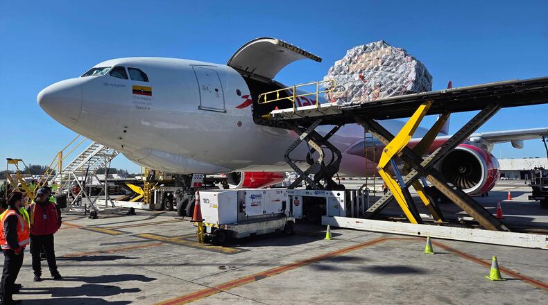 Boxes of Valentine's Day flowers arrive from Colombia at Miami International Airport, on Friday, Feb. 6, 2026, in Miami. (AP Photo/David Fischer)