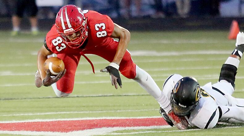 Fairfield tight end Erick All is tripped up by Centerville defensive back Dom Ramsey during Friday’s Skyline Chili Crosstown Showdown contest at Fairfield Stadium. The host Indians lost 30-23. CONTRIBUTED PHOTO BY E.L. HUBBARD