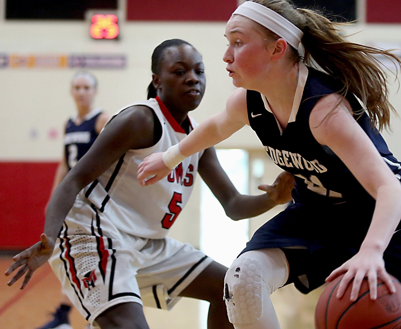 Edgewood guard Cierra Lipps drives past Mt. Healthy’ss Destiny Allen during Saturday afternoon’s game at Mt. Healthy. CONTRIBUTED PHOTO BY E.L. HUBBARD
