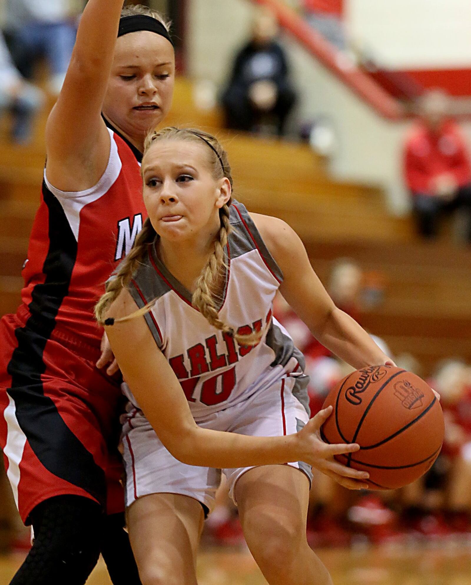 Carlisle guard Christa Harris is covered by Madison’s Kenzi Saunders during their game at Carlisle on Dec. 10, 2016. COX MEDIA FILE PHOTO