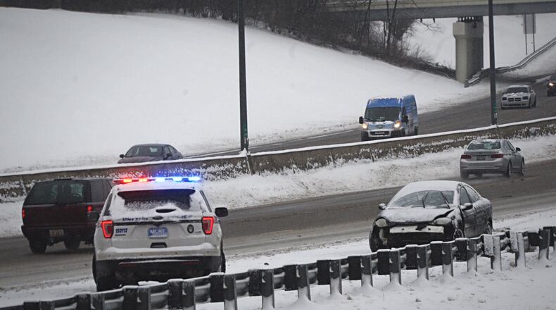 Slide outs were familiar sight early Thursday morning on Feb. 18, 2021.
This motorist slid off US 35 east near downtown Dayton. MARSHALL GORBY\STAFF