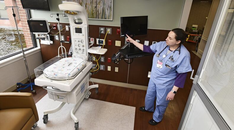 Jennifer Simmons, Clinical Coordinator/lactation consultant, shows off one of the new private rooms in the new special care nursery at Fort Hamilton Hospital Wednesday, March 20, 2019 in Hamilton. There are now eight private rooms for newborns and families instead of six babies in one room that the previous special care unit offered. NICK GRAHAM/STAFF