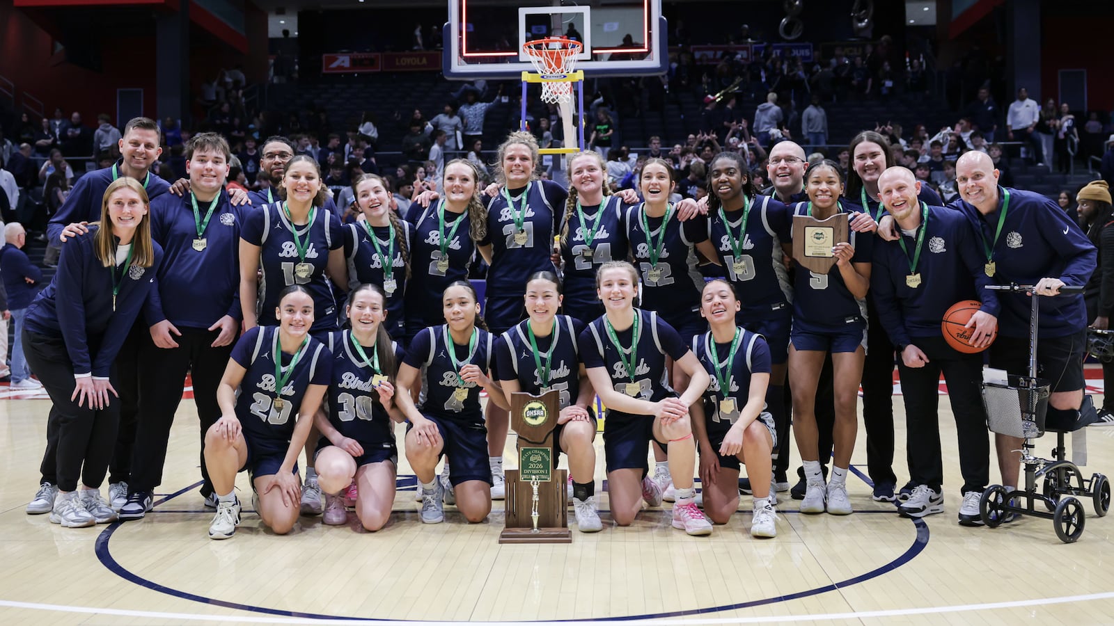 Fairmont players and coaches pose for a photo after defeating Cincinnati Princeton 61-55 in overtime of the Division I state final on Saturday, March 14 at University of Dayton Arena. BRYANT BILLING / STAFF