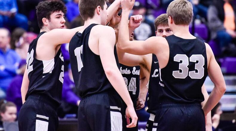 Lakota East players huddle during a 61-47 win over Middletown on Jan. 8 at Wade E. Miller Arena in Middletown. NICK GRAHAM/STAFF