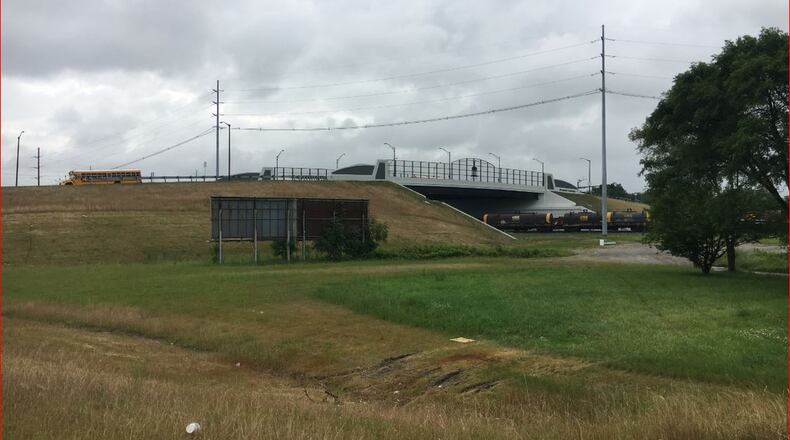 Money left over from the South Hamilton Crossing overpass will be used to create a North Hamilton Crossing study, to buy a paramedic ambulance and pave some roads. MIKE RUTLEDGE/STAFF